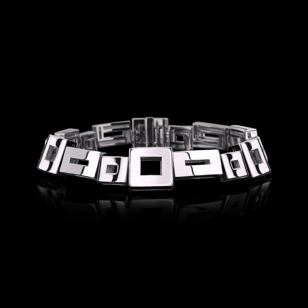 Geometric bracelet set in 18ct white gold with baguette cut ruby in clasp by Stefano Canturi