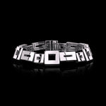 Geometric bracelet set in 18ct white gold with baguette cut ruby in clasp by Stefano Canturi