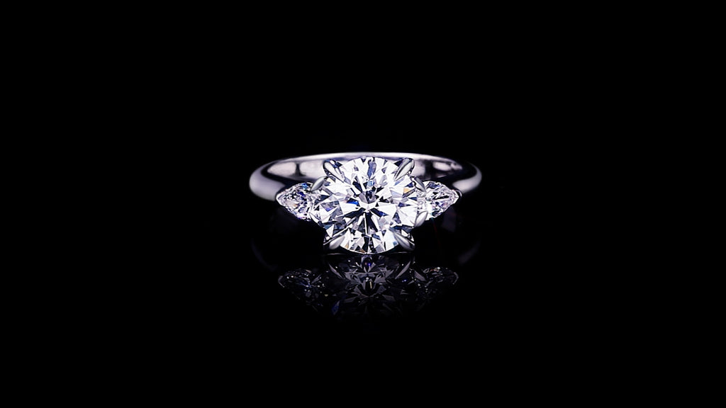 Trilogy 2.50ct Round diamond engagement ring with Pear shape diamonds set in 18ct white gold by Stefano Canturi
