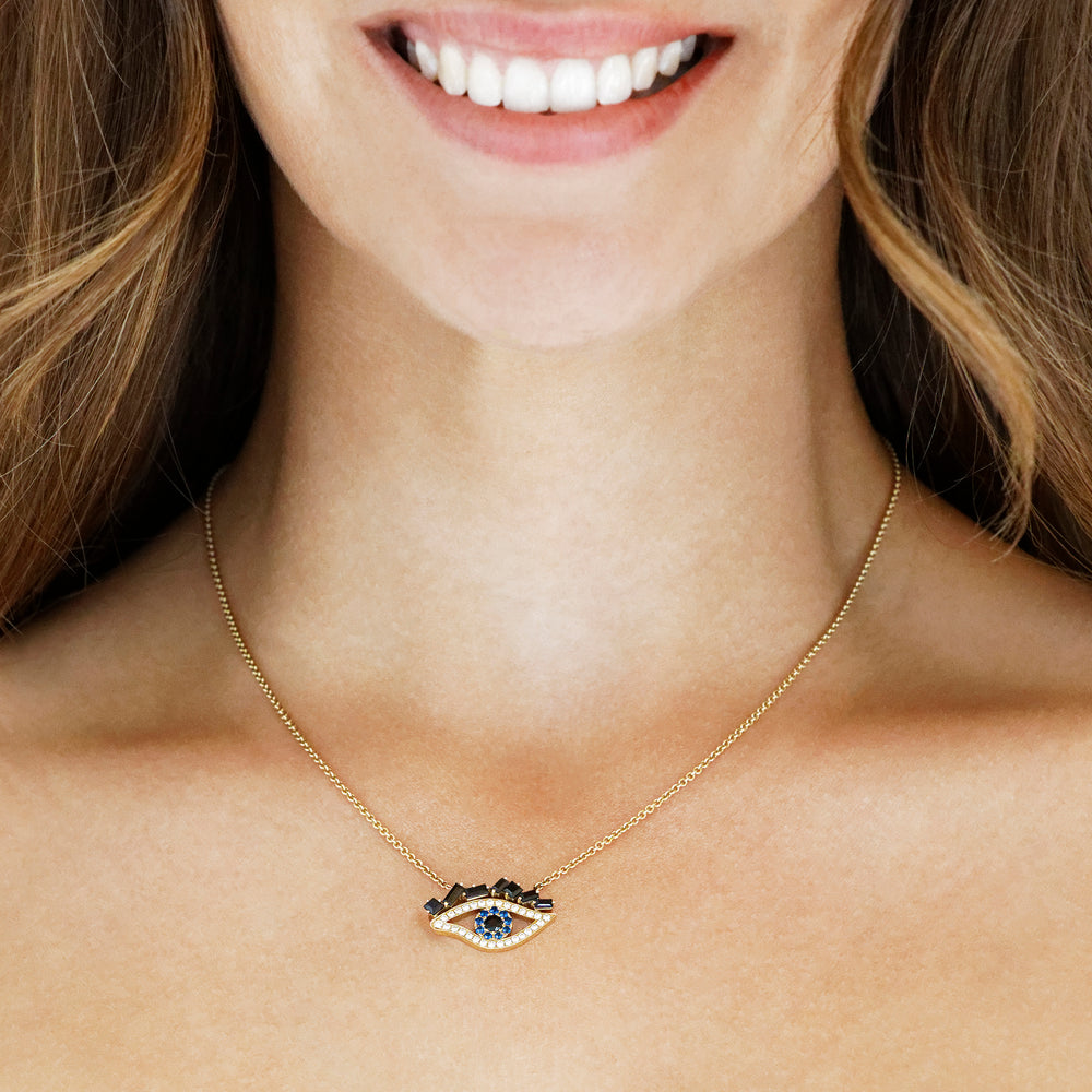 Cubism Eye pendant necklace set in 18ct yellow gold with Australian black sapphires, diamonds, spinel gemstones by Stefano Canturi.
