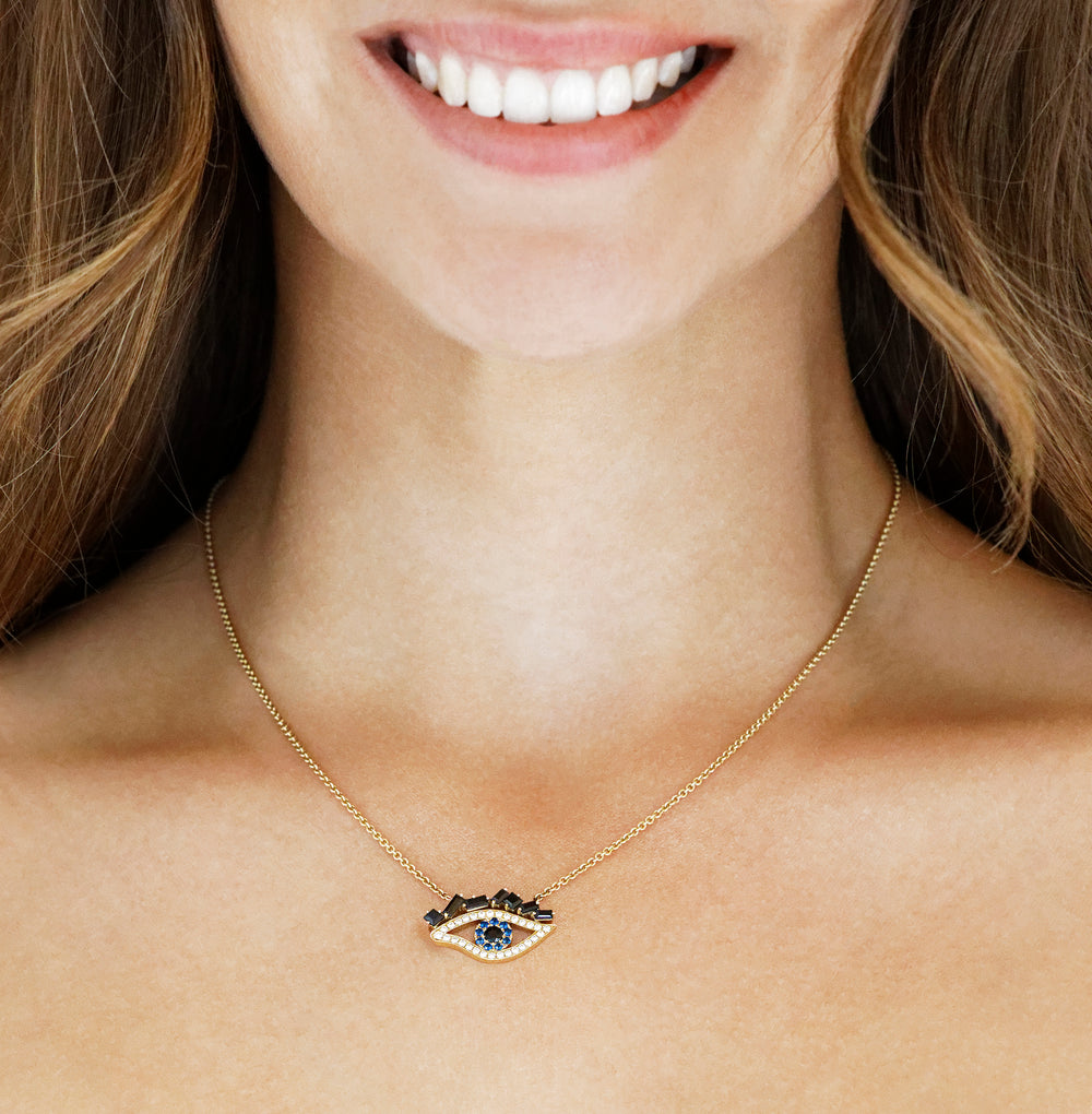 Cubism Eye pendant necklace set in 18ct yellow gold with Australian black sapphires, diamonds, spinel gemstones by Stefano Canturi.